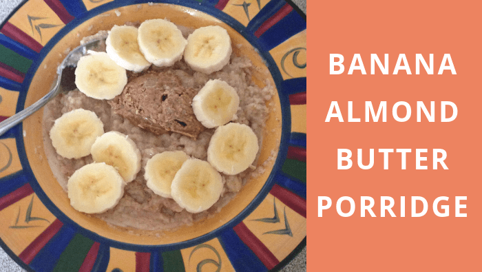 Coconut milk porridge topped with banana and almond butter blog header image
