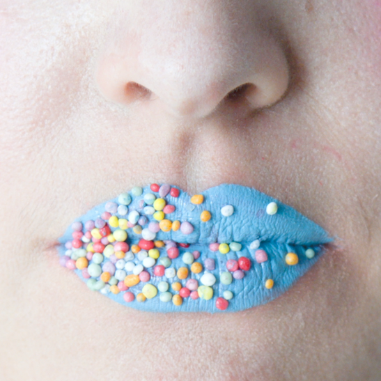 woman with blue lips and hundreds and thousands