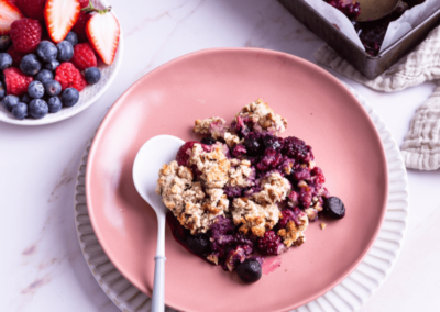 A slice of sugar free berry crumble on a plate