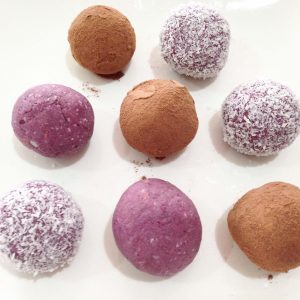 No bake berry bliss balls with chocolate and coconut coating