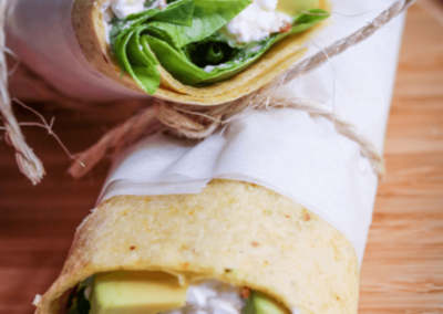 Cottage cheese, avocado and sun dried tomato brekkie wrap in two halves
