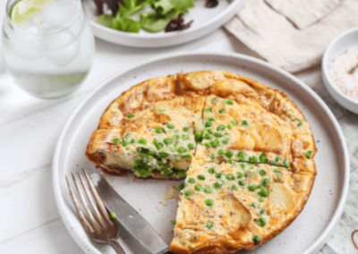 Green pea, potato and goats cheese frittata on a plate