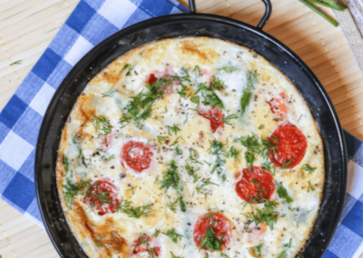 Smoked salmon, feta and asparagus omelette in a serving dish