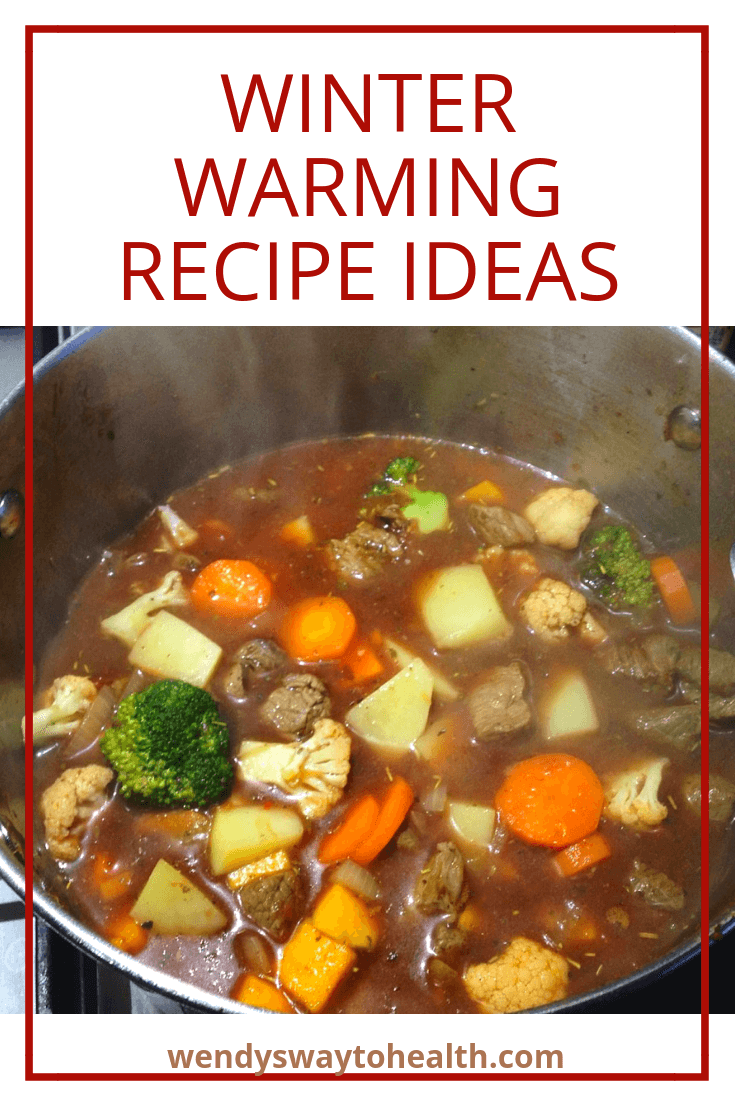beef and vegetables stew cooking in a pot on the stovetop