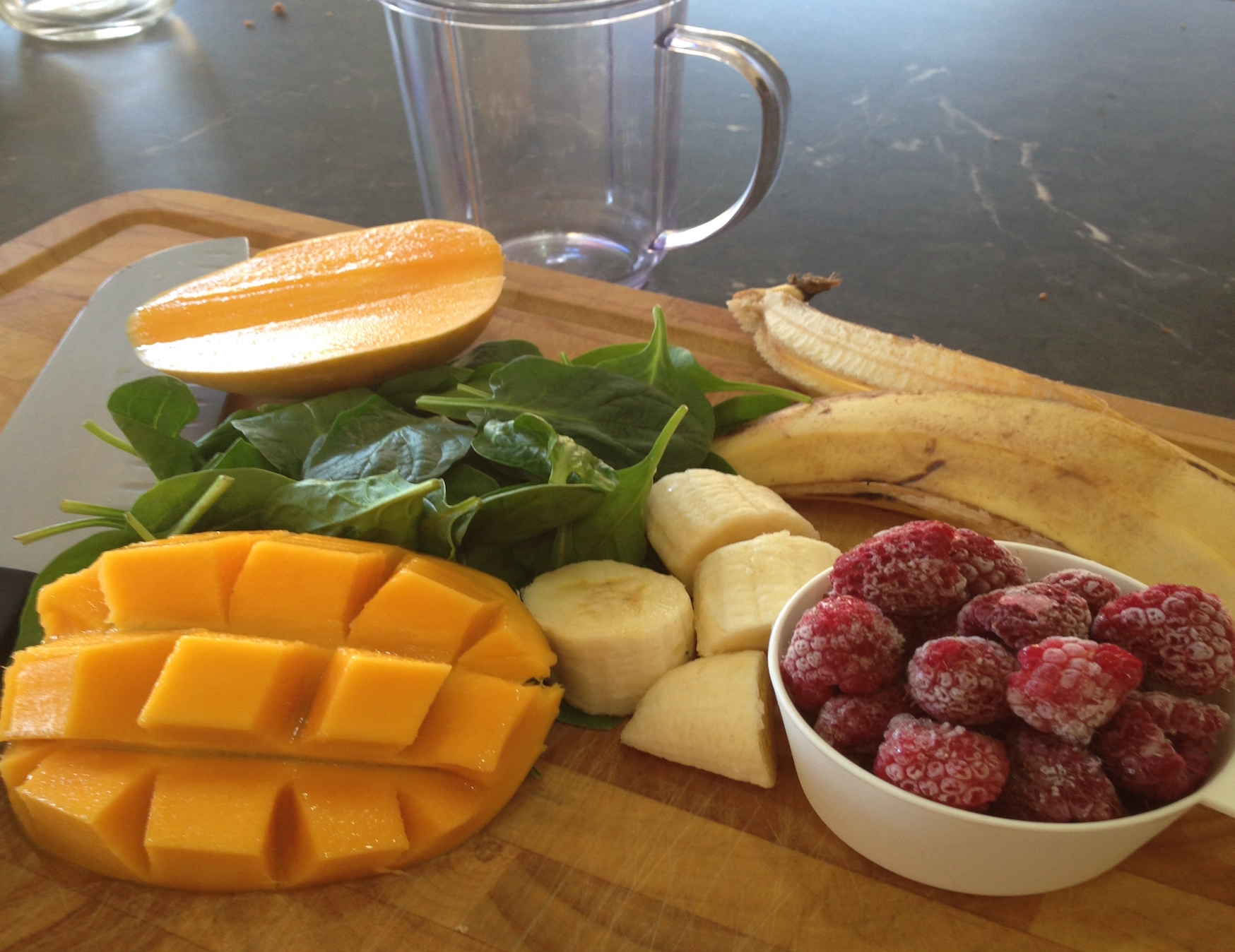 Green smoothie  ingredients on a chopping board