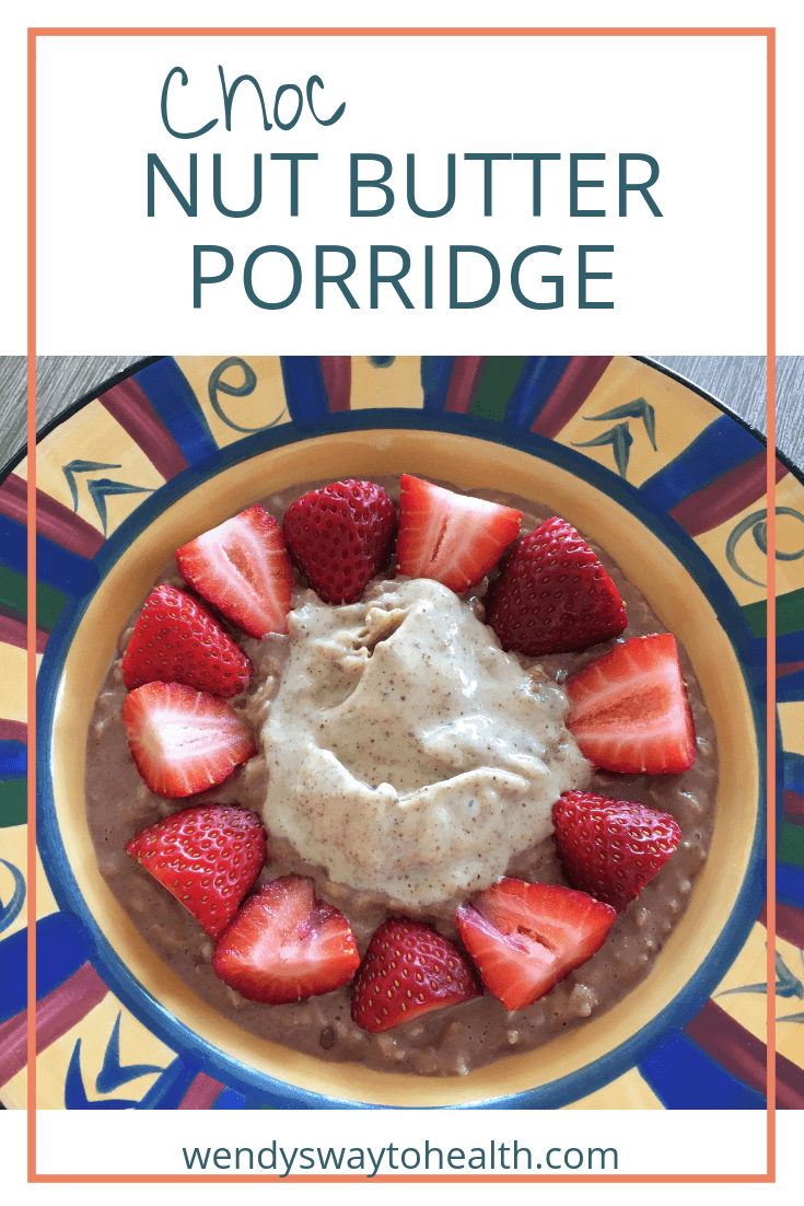 chocolate porridge topped with nut butter and strawberries