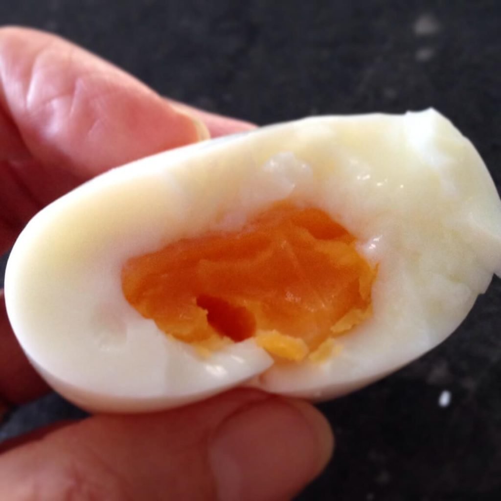 close up of a half eaten hard boiled egg