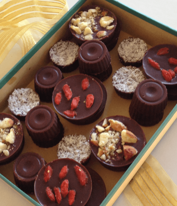 home made chocolates in a box tied with gold ribbon