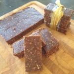 No bake chocolate energy bars on a chopping board, some tied with ribbon 2