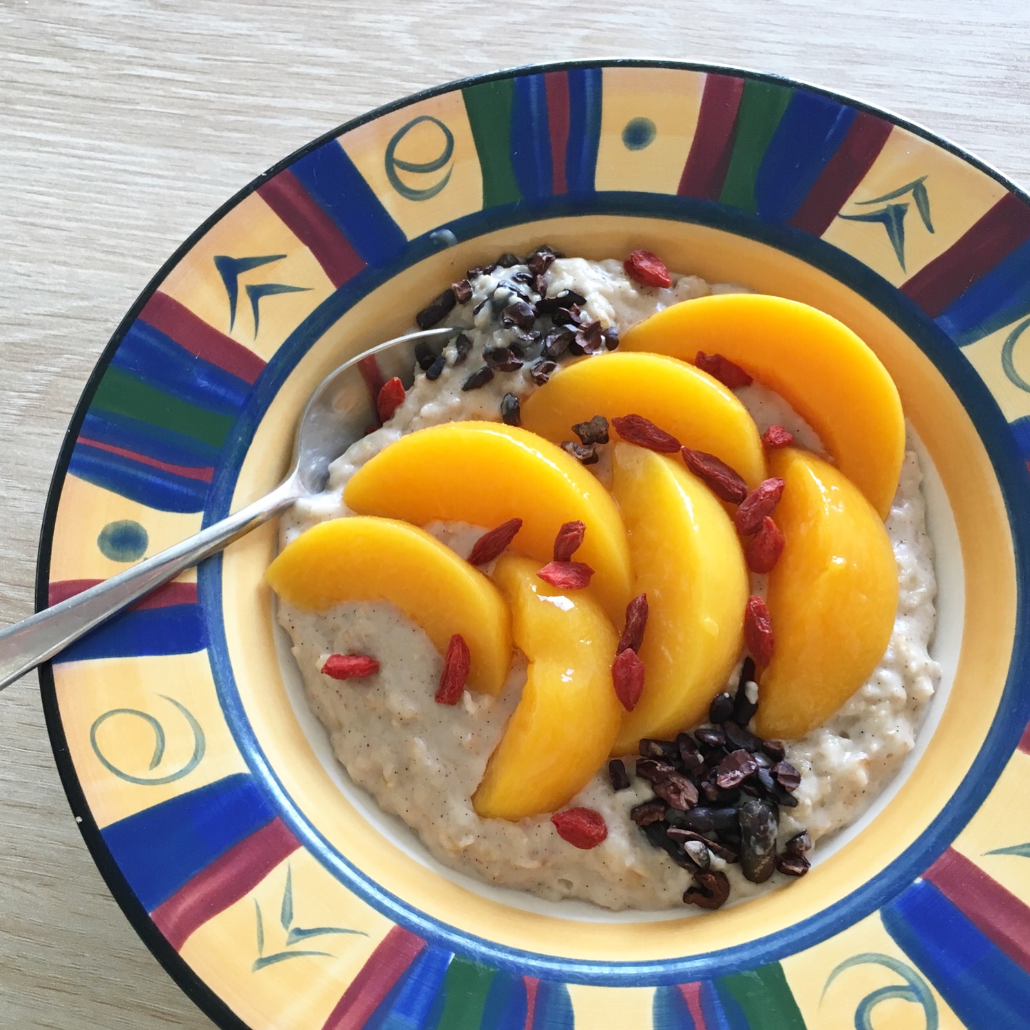 occonut milk porridge in a bowl topped with fruit