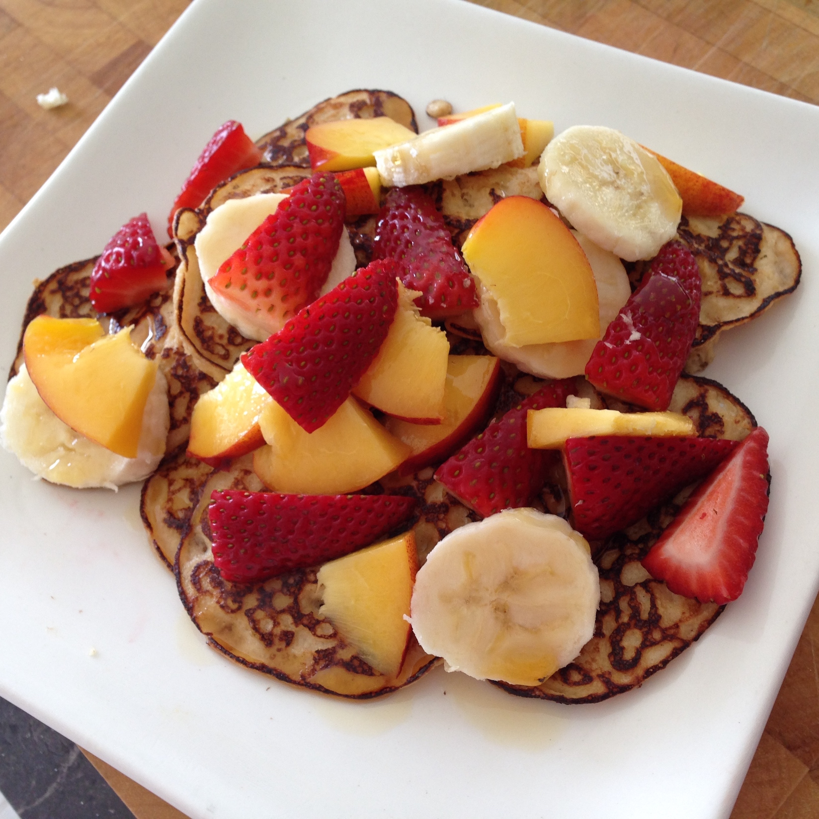 Easy weekend pancakes topped with fruit