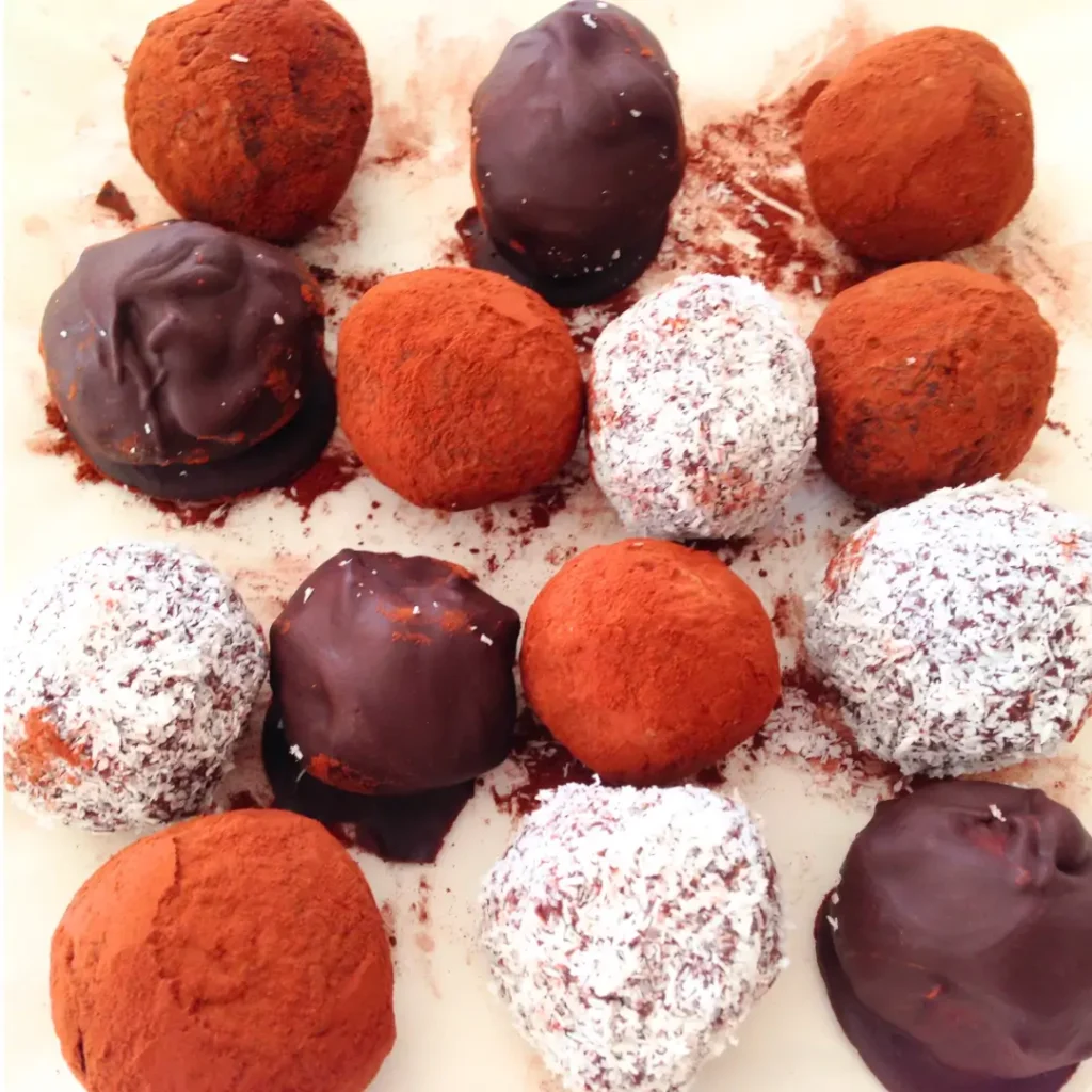 A mixture of chocolate truffles on a plate