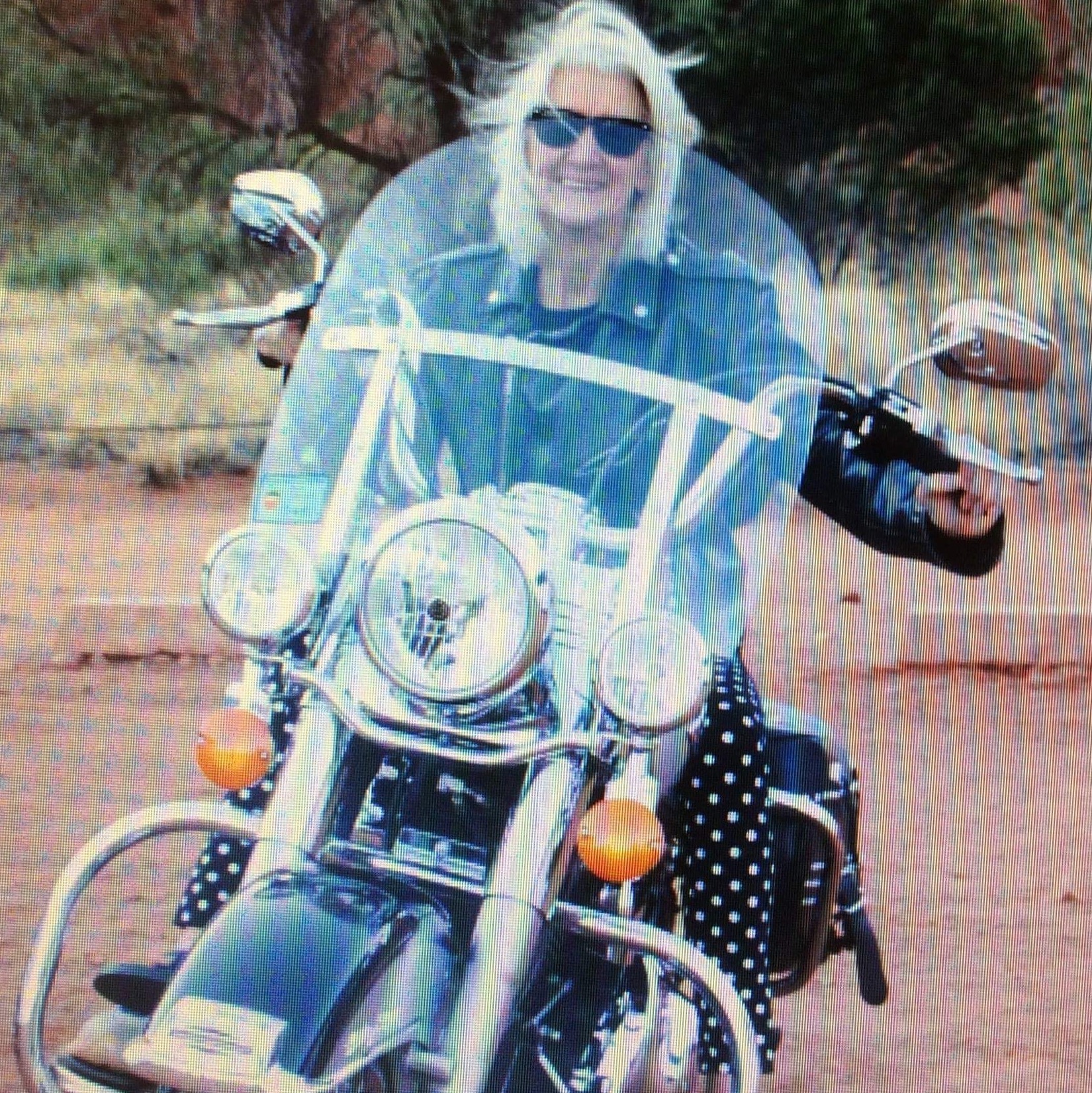 Diane posing on a motorbike