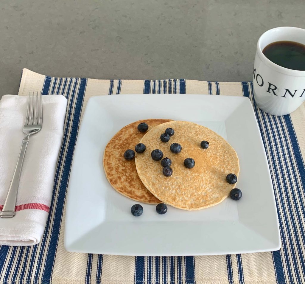 3 ingredient protein pancakes topped with berries