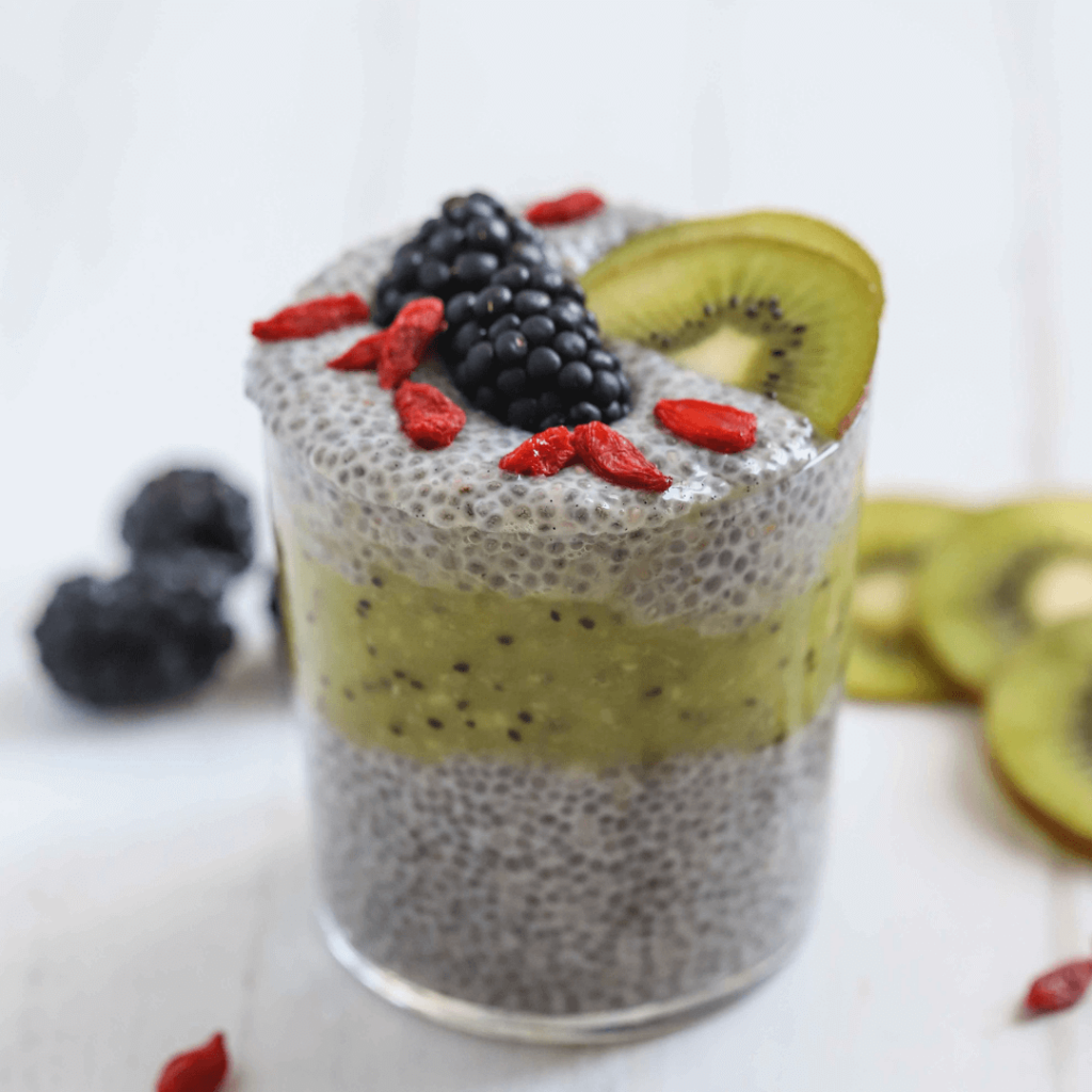 Kiwi chia pudding layered in a glass