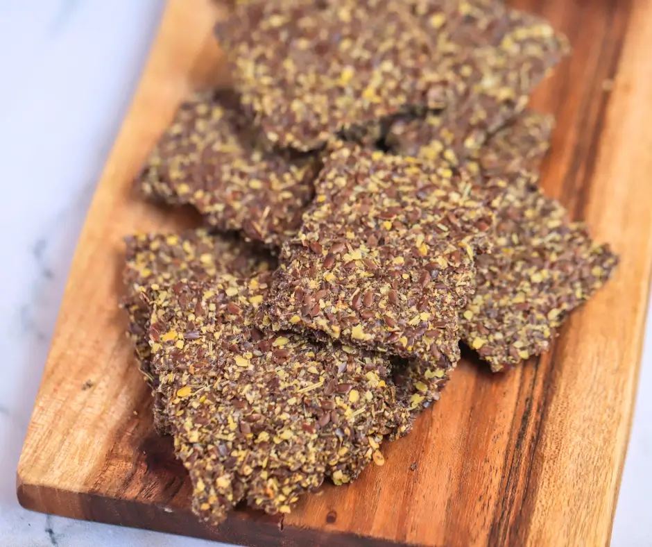 Close up of flaxseed crackers on a board
