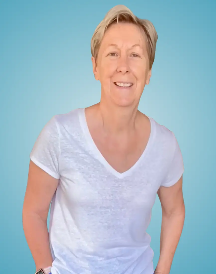 Close up of Wendy in a white t-shirt, with a blue background