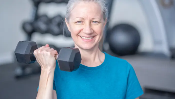 Woman holding a dumbbell