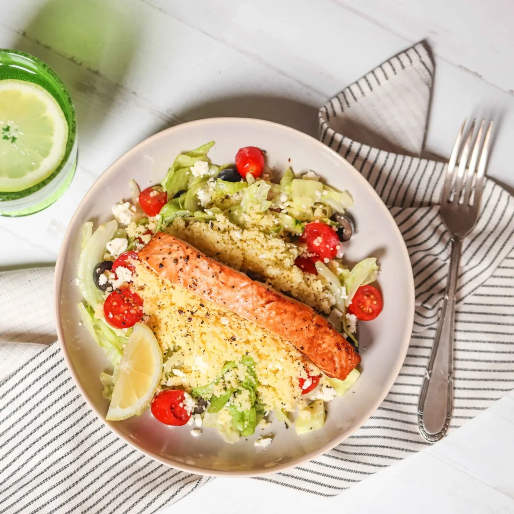 salmon couscous salad on a dinner plate
